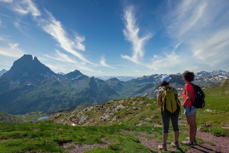 two hiker women in the path of the french Pyrenees mountainsの写真素材
