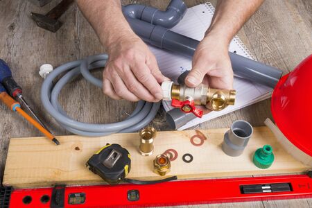 a close up of plumbing with different tools and accessoriesの写真素材