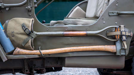 Detail of different work tools on the side of the military vehicle. Shovel, Axの写真素材