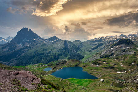 view of Pic du Midi Ossau and Ayous lake in french Pyrenees mountains