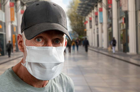 Portrait of senior man in a medical mask. Concept of the danger of coronavirus
