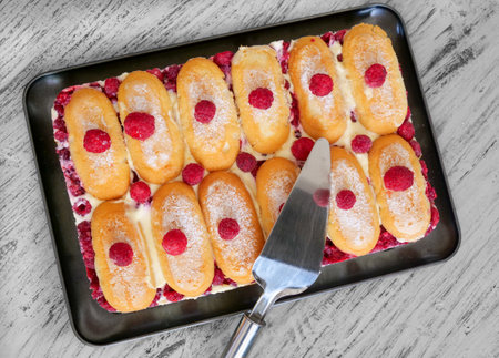 homemade cupcakes with a raspberry on top