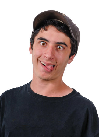 young man grimacing on the white backgroundの写真素材