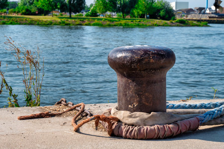 close up of an old and rusty mooring postの写真素材