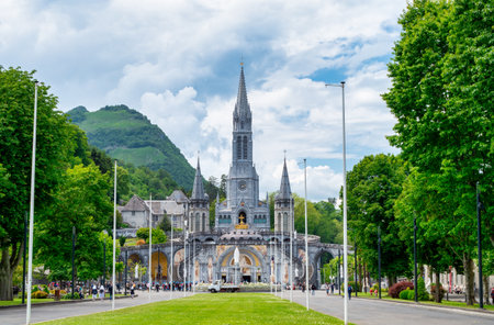 A view of the basilica of Lourdes, Occitania, France. The scene is peacefulの写真素材