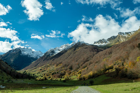 Mountain range with snow on the top and a clear blue sky. Lake, Hautes Pyrenees, Franceの写真素材