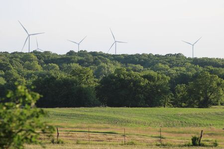 Electricity generating windmills near farm