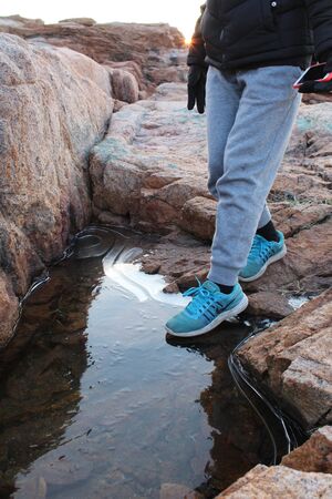Child stepping on thin ice, logos removed