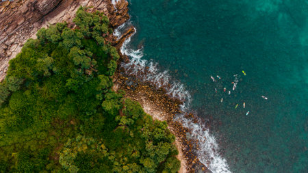 Aerial view of beautiful tropical beach and sea with kayak and canoeの写真素材