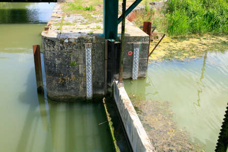 Dam to regulate the height of the water in the marsh poitevinの写真素材