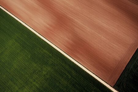 Aerial view of a path through the fieldsの写真素材