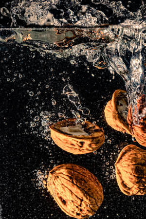 walnuts falling in water