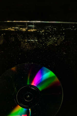 compact disc thrown into water