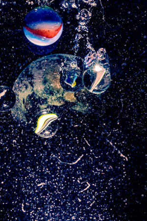 marbles thrown into water