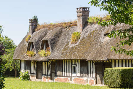traditional Norman house, with thatched roofの写真素材