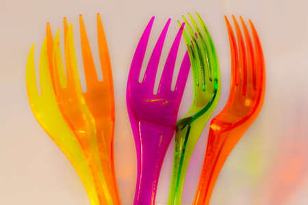 multicolored plastic forksの写真素材