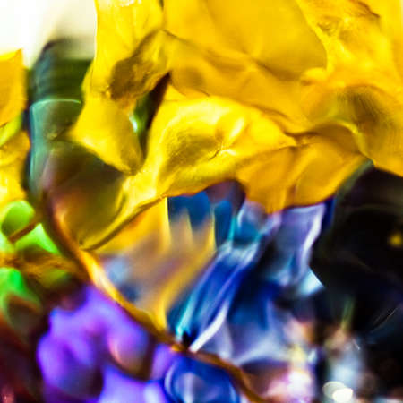 watercolor drops in a glass of water, close upの写真素材