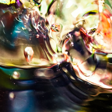watercolor drops in a glass of water, close up