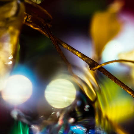 watercolor drops in a glass of water, close upの写真素材