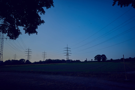 Power poles in a sunsetの写真素材
