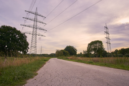 a cloudy sky and a power poleの写真素材