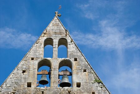 Triangular medieval church towerの写真素材