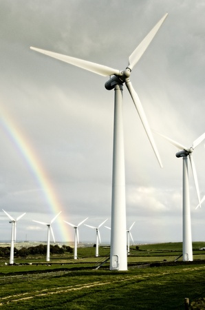 Wind turbines and rainbowの写真素材