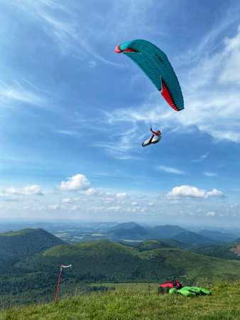 Paraglider flying in the blue skyの写真素材