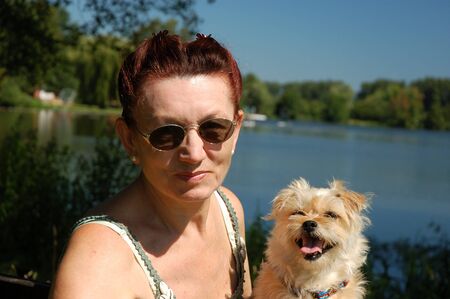 Senior woman with her dogの写真素材