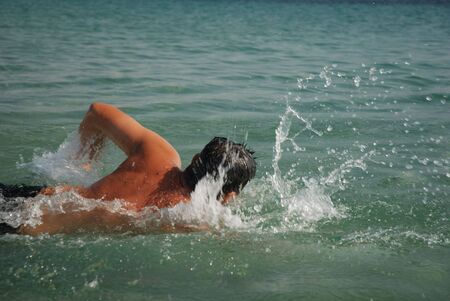 Swimmer in mediterranean seaの写真素材