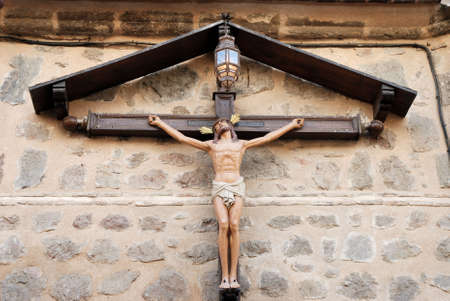  Jezus hanging on a cross against an old brick wallの写真素材