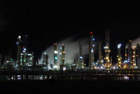 Oil refinery illuminated at night