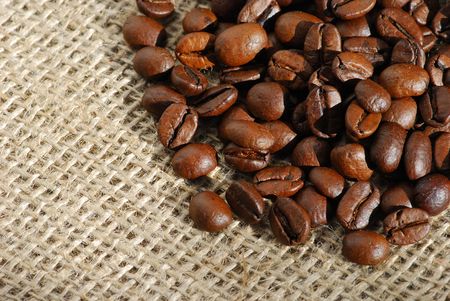 Coffee beans on burlapの写真素材
