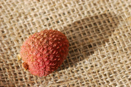 Lychee macro on burlapの写真素材