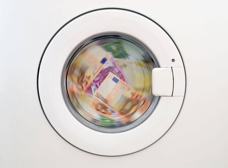 money laundring in the washing machineの写真素材