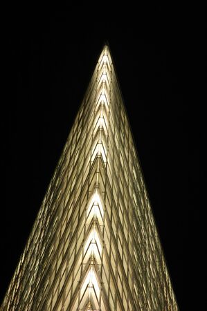 Futuristic Skyscraper Facade at Nightの写真素材