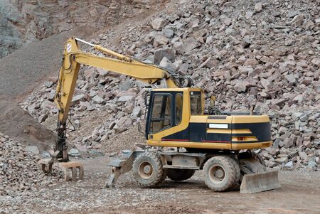 Excavator in a stone pitの写真素材