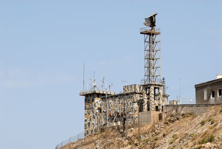 Military tower with radar and antennasの写真素材