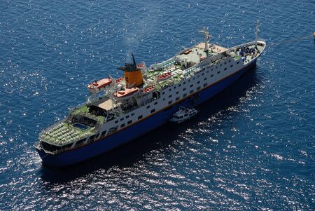 Cruise ship in harbor of Santorini, Greeceの写真素材
