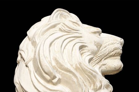 Lion Statue isolated on black backgroundの写真素材