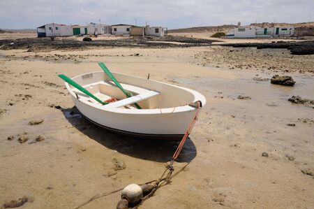 Fishing boat and village on Canary Island Fuerteventura, Spain