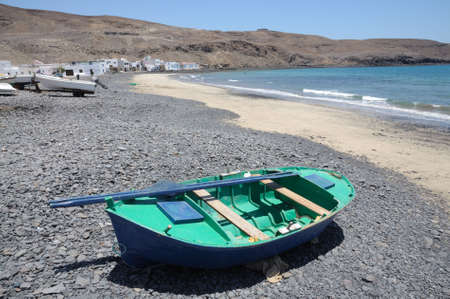 Fishing boat on the beach of Pozo Negro, Canary Island Fuerteventura, Spain