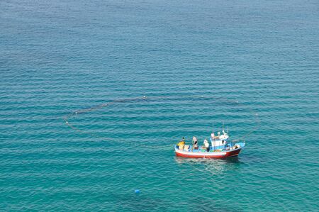Fishing boat with a net in the sea