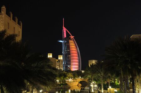 Madinat Jumeirah and Burj Al Arab at night. Dubai United Arab Emiratesのeditorial素材