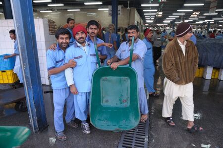 Dubai, January 23 2010: Workers at the Fish Market in Dubai, United Arab Emiratesのeditorial素材