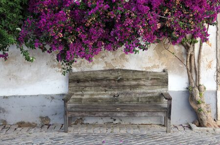 Wooden bench in the old town of Faro, Algarve Portugalの写真素材