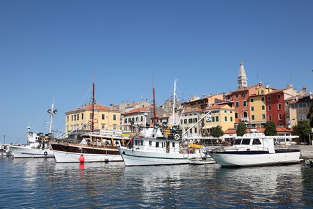 Fishing boats in the old harbor of Rovinj, Croatiaの写真素材