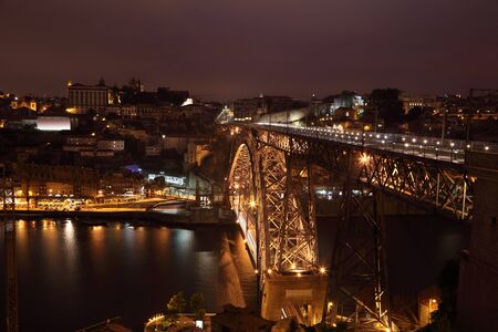 View over the Dom Luis I bridge and Porto at night, Portugal