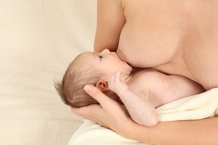 Mother breastfeeding her newborn baby