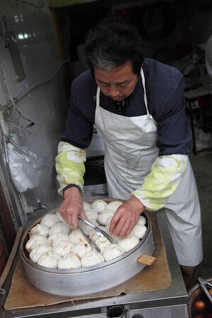 Traditional Chinese steamed bun seller in Shanghai, China. Photo taken at 16th of November 2010のeditorial素材